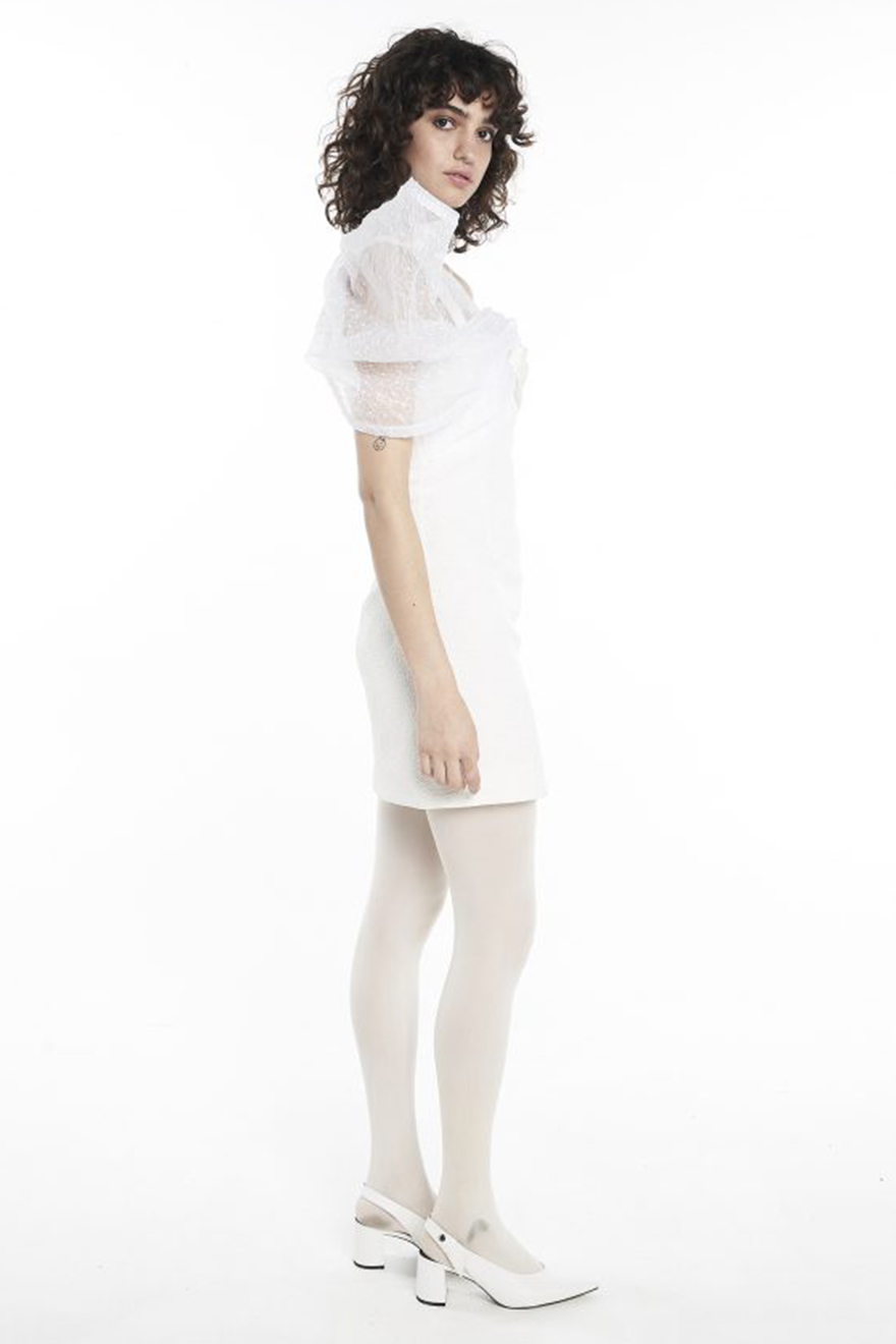 Model wearing Nicola Finetti Zoe white textured strapless mini with shoulder ruffle