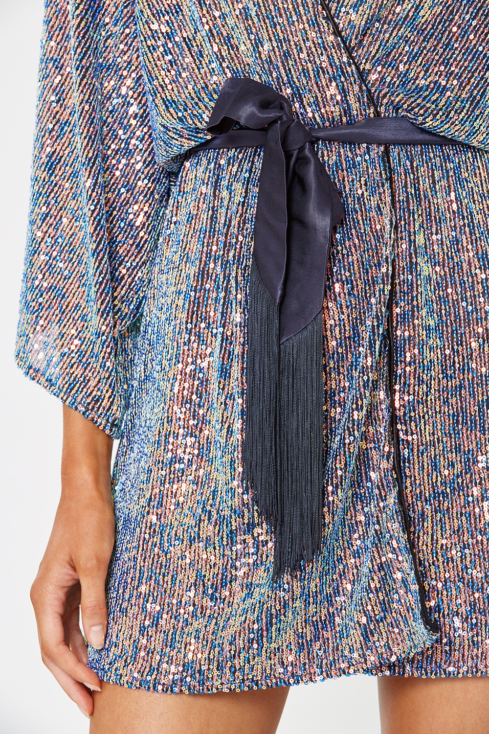 Close-up of blue pink and gold micro-sequins on Winona Fantasia dress and belt
