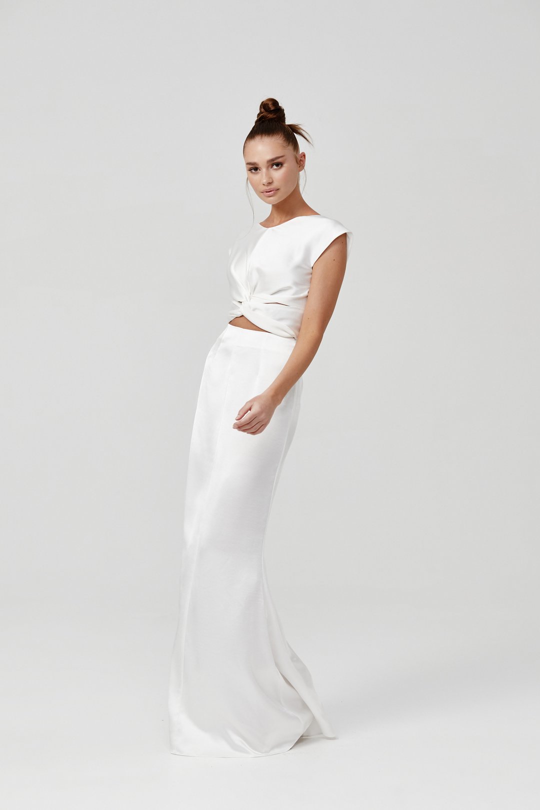 Model wearing Lexi Kiera white satin floor-length gown with cap sleeves