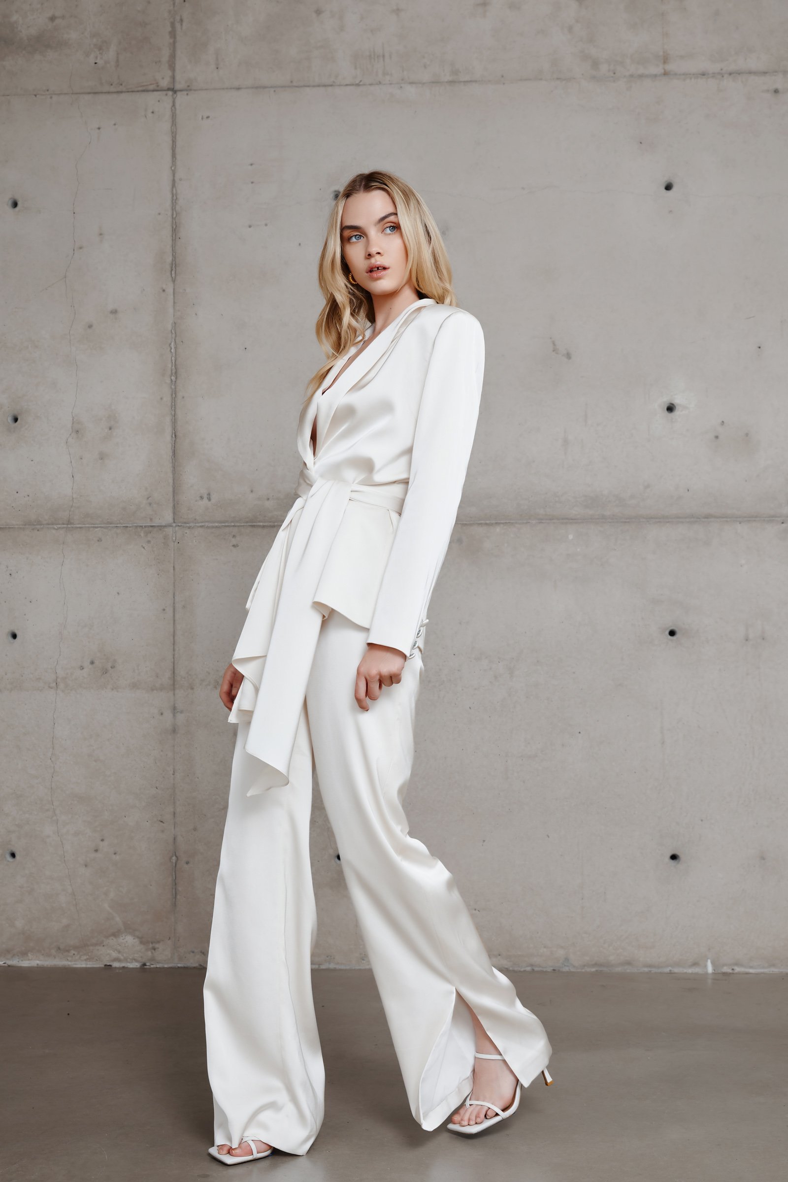 Model wearing Lexi Sade Jacket and Dosa Pant Set in Oyster