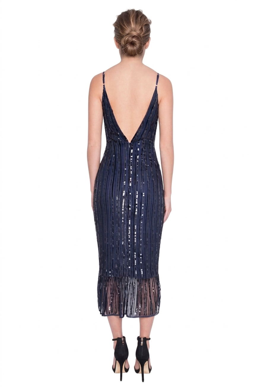 Back of Madame X Siyana navy sequin dress with asymmetric ruffle hem