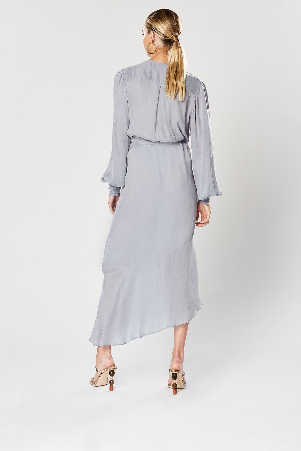 Back of Winona Cosmo blue wrap dress showing pleat-back detail