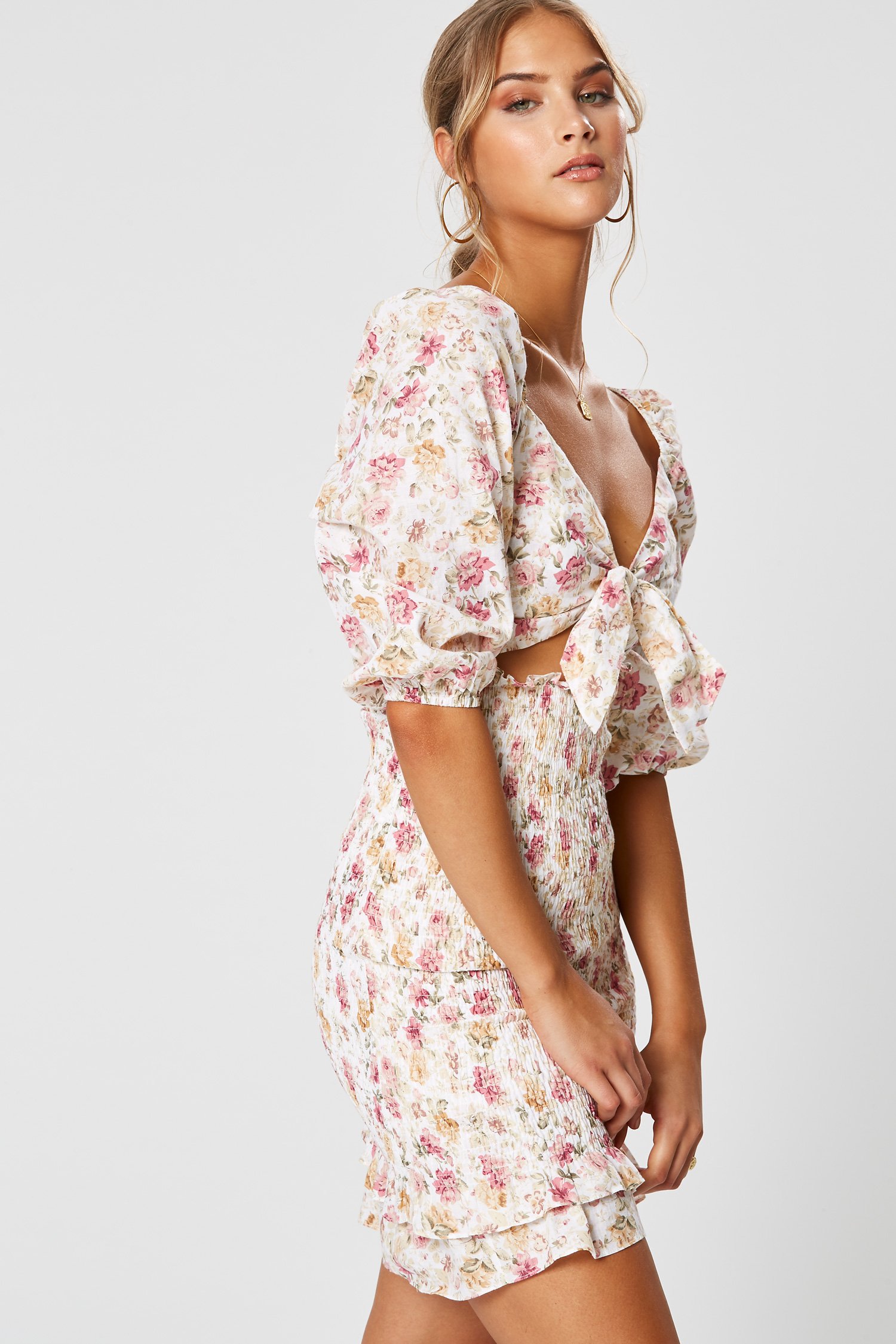 Model wearing Winona Florence floral tie-front mini dress with blouson sleeves