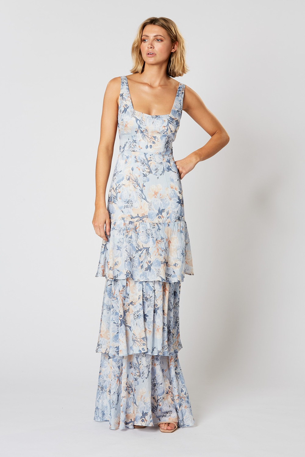 Winona Marina blue floral maxi dress with angular neckline and tiered frill skirt