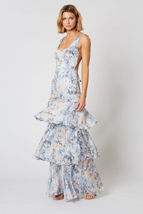 Model wearing Winona Marina blue watercolour floral tiered maxi dress