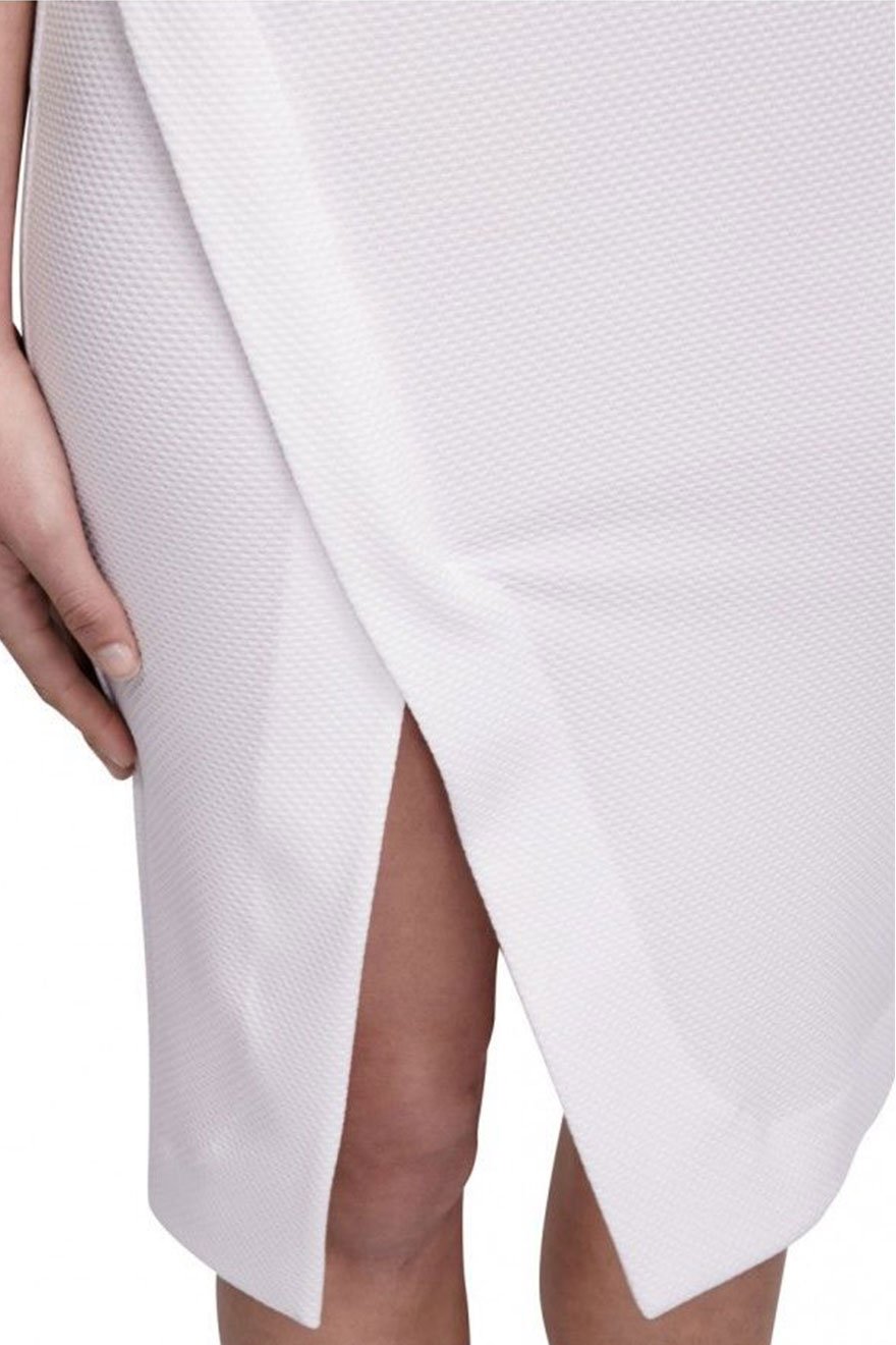 Close-up of textured ponti fabric on Nicholas white deep V dress