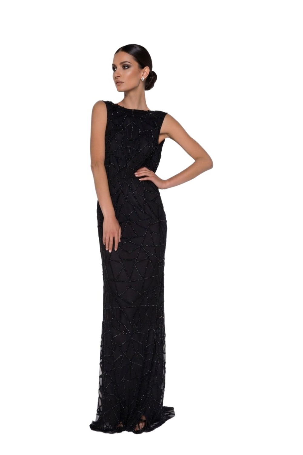 Model wearing Madame X Gracie black beaded column gown with sheer hem