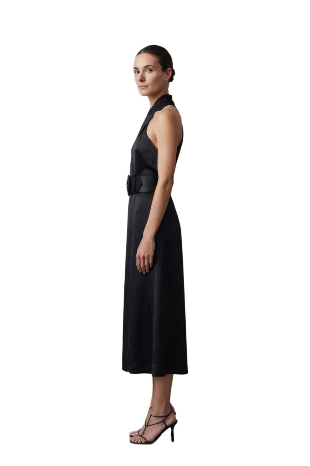 Model wearing Nicholas Colva black silk halter midi dress with belt