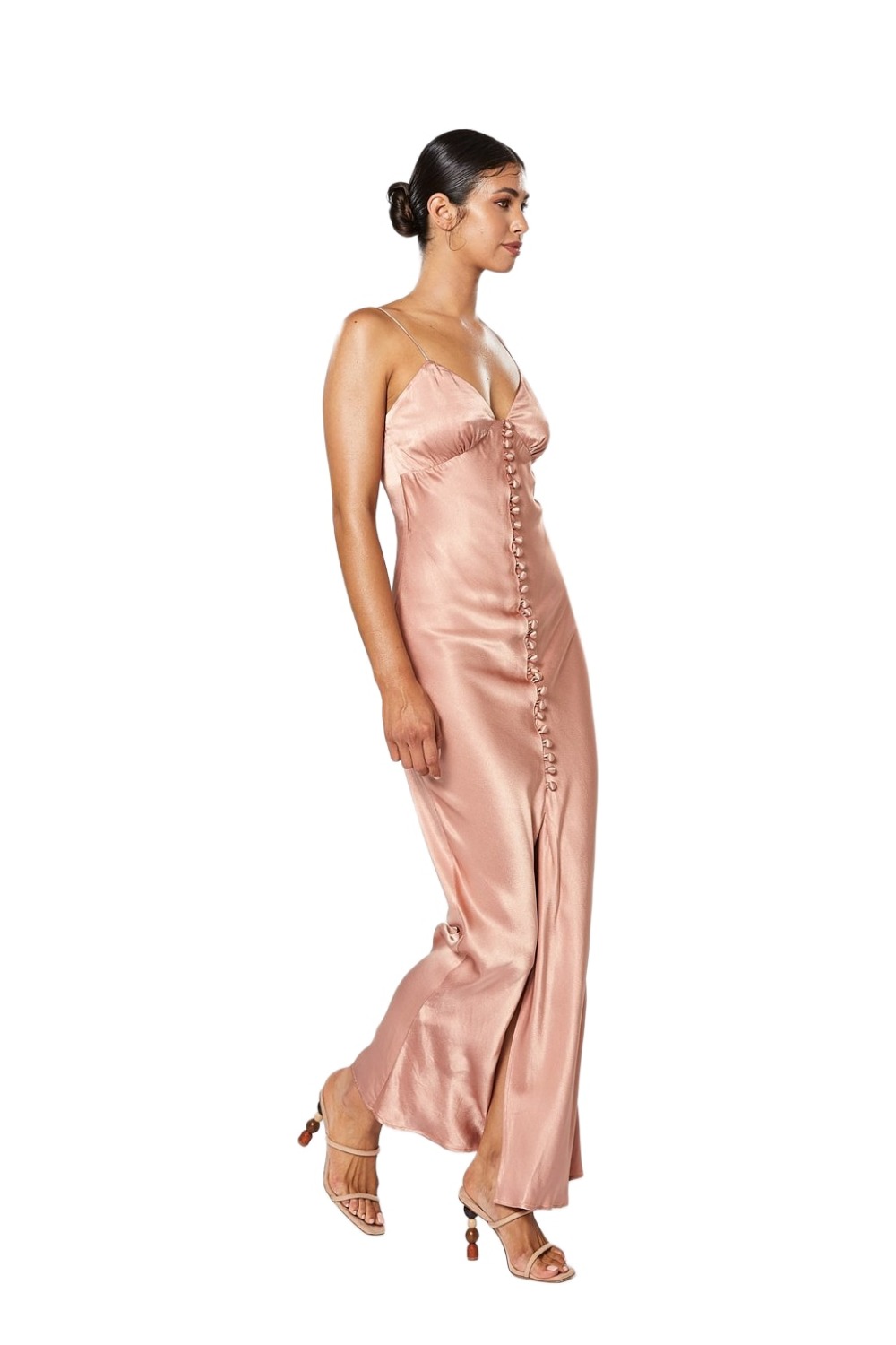 Model wearing Winona Zola dusty pink bias-cut satin slip maxi with button front demonstrating the side